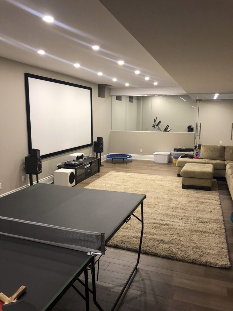 Basement renovation in Uxbridge with home theatre and gym.